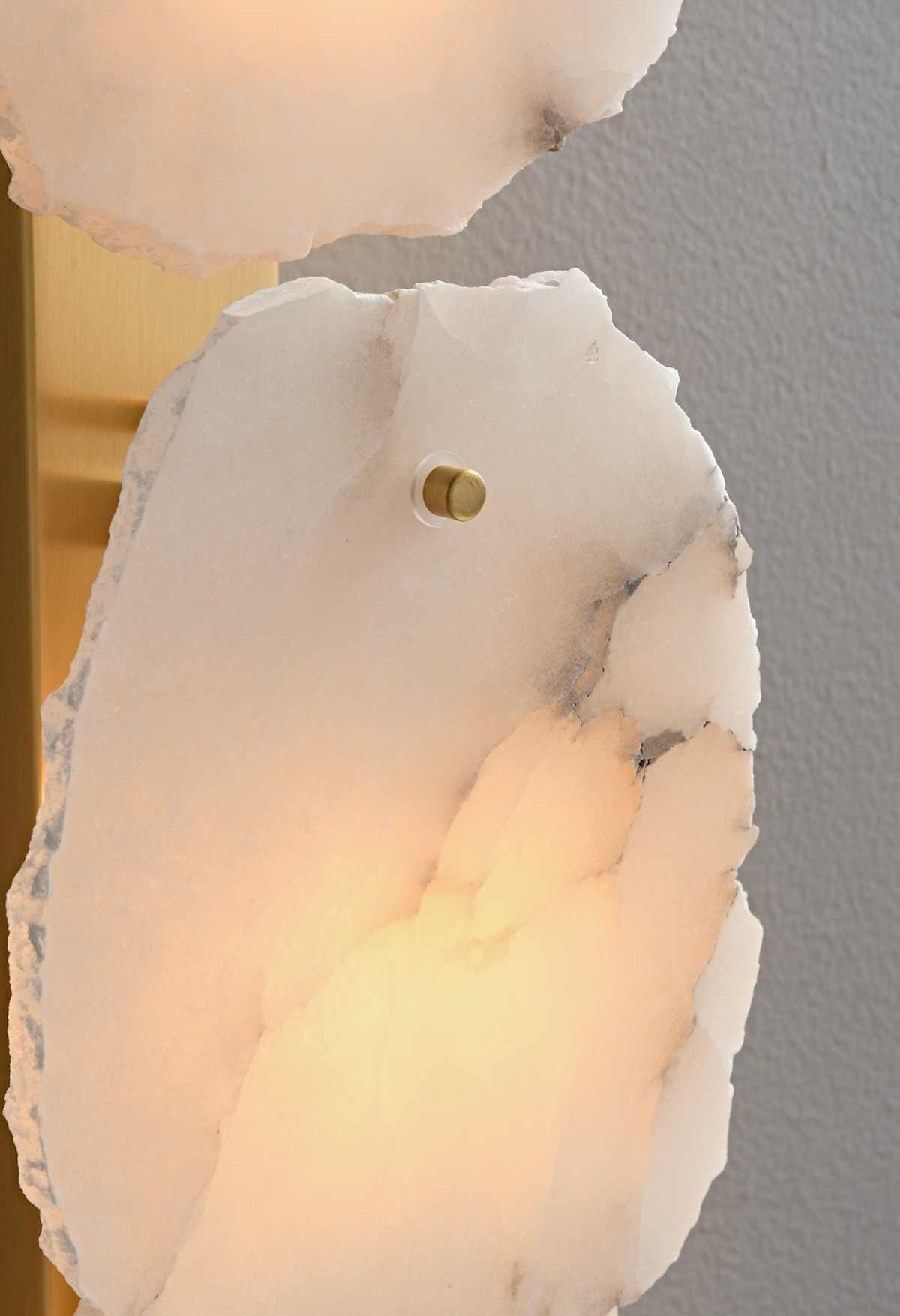 Alabaster pendant light glowing in a luxury interior